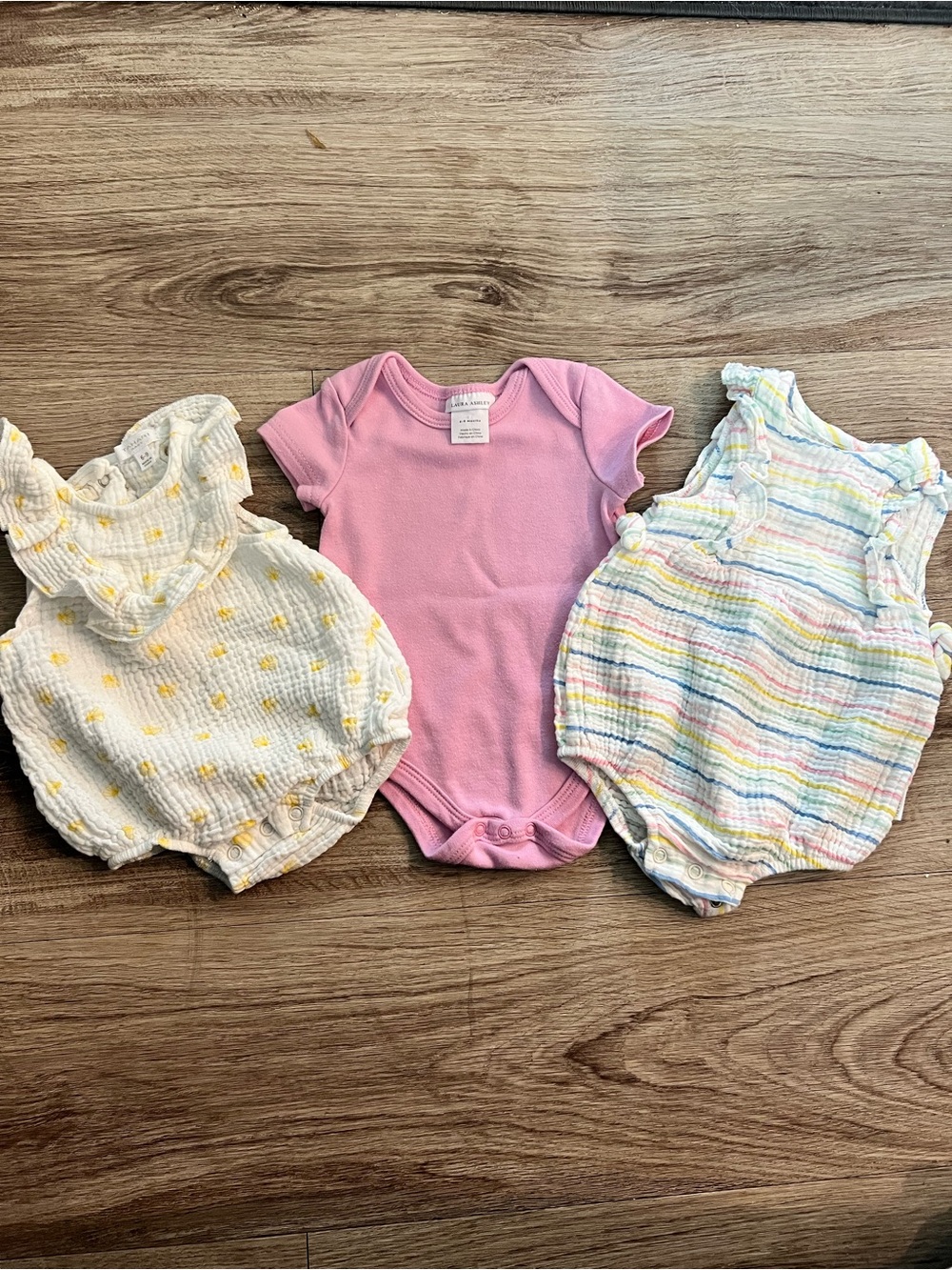 Three 6-9 months one piece outfits